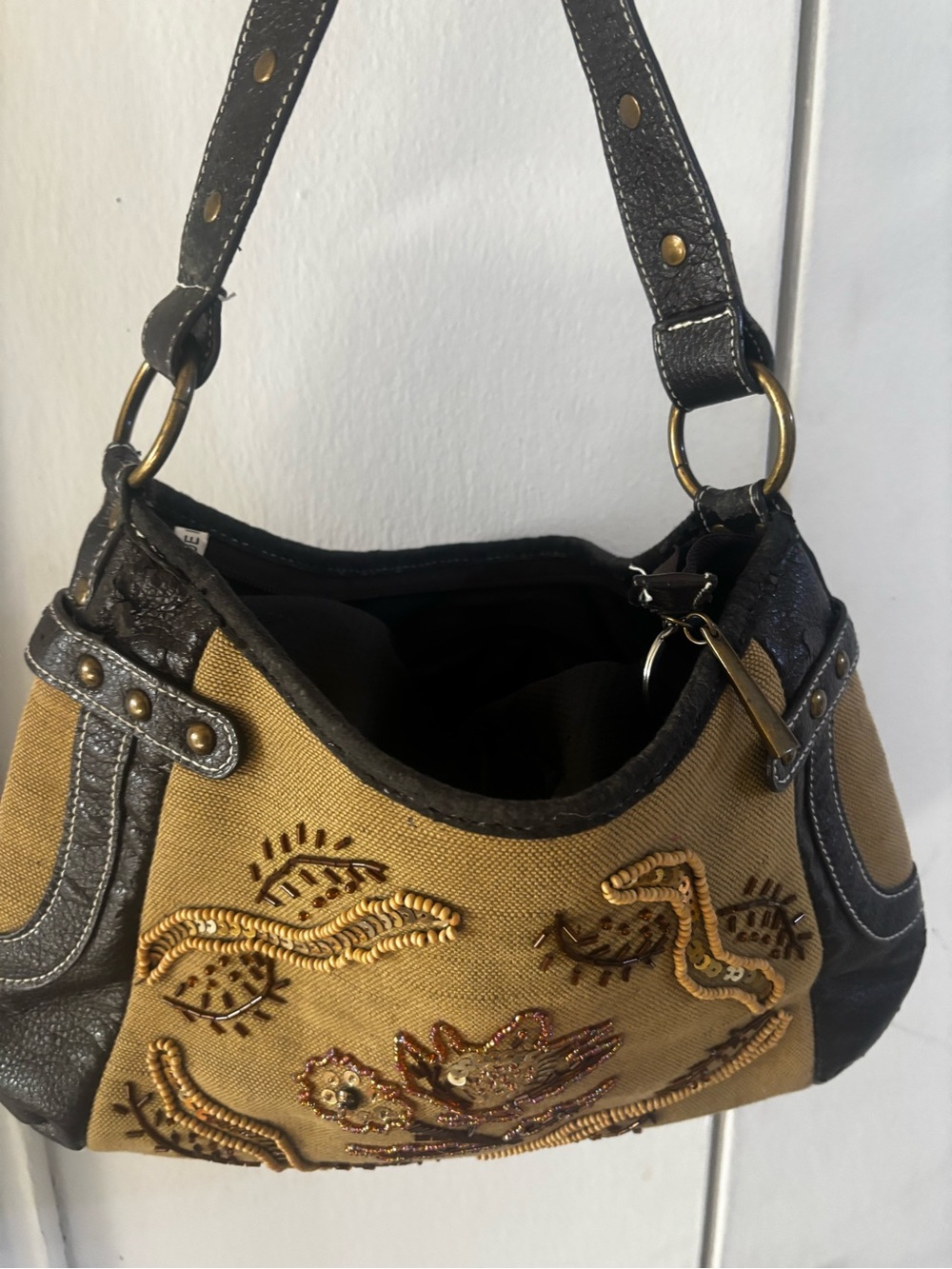 tan canvas and black pebbled leather accented with metallic studs VTG
